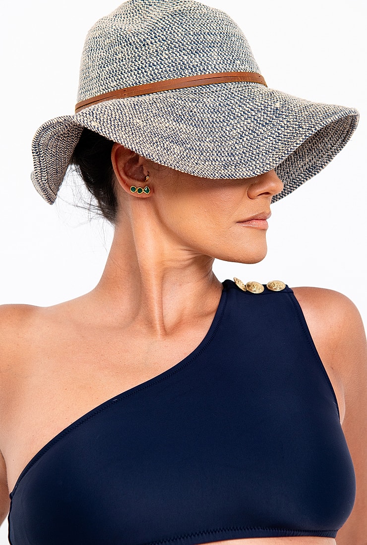 Woman in stylish hat and swimwear.