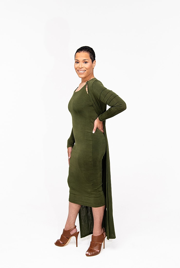 Woman in green dress with stylish heels.