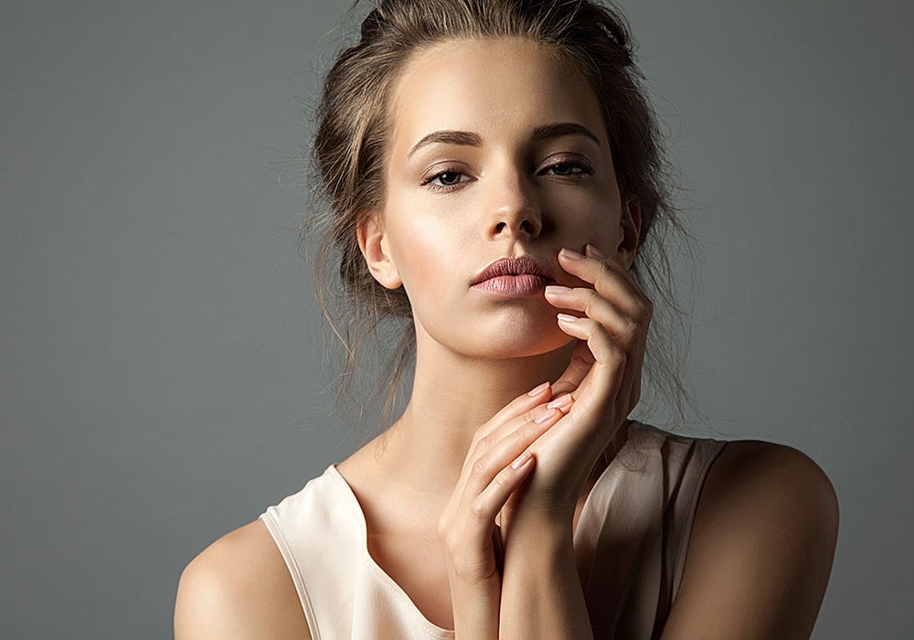 Atlanta Facelift model touching their face